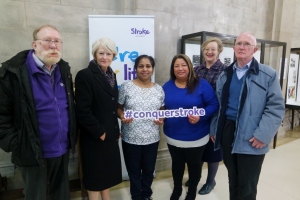 Photograph of Nancy Rothwell with stroke survivors at the exhibition